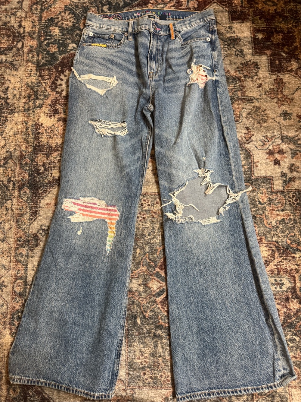 Women’s Distressed Blue Wide-Leg Jeans with Patch Details
